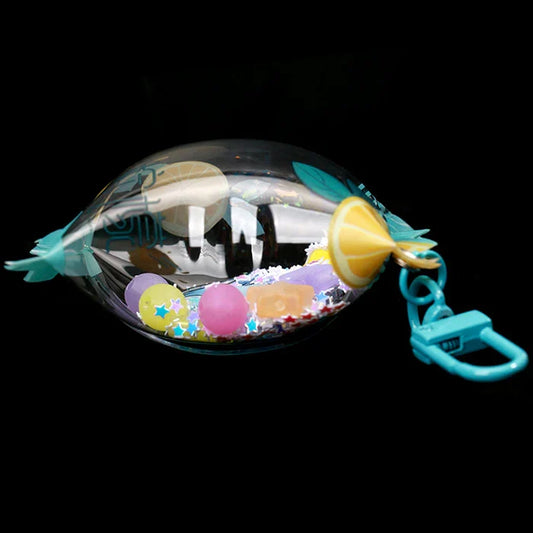 Custom candy keychain with clear acrylic capsule, colorful beads, and lemon charm