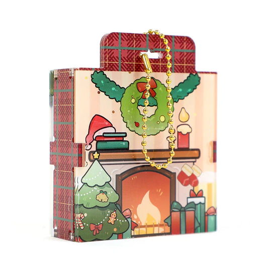 Custom acrylic display case with Christmas fireplace, wreath, and tree design, gold ball chain