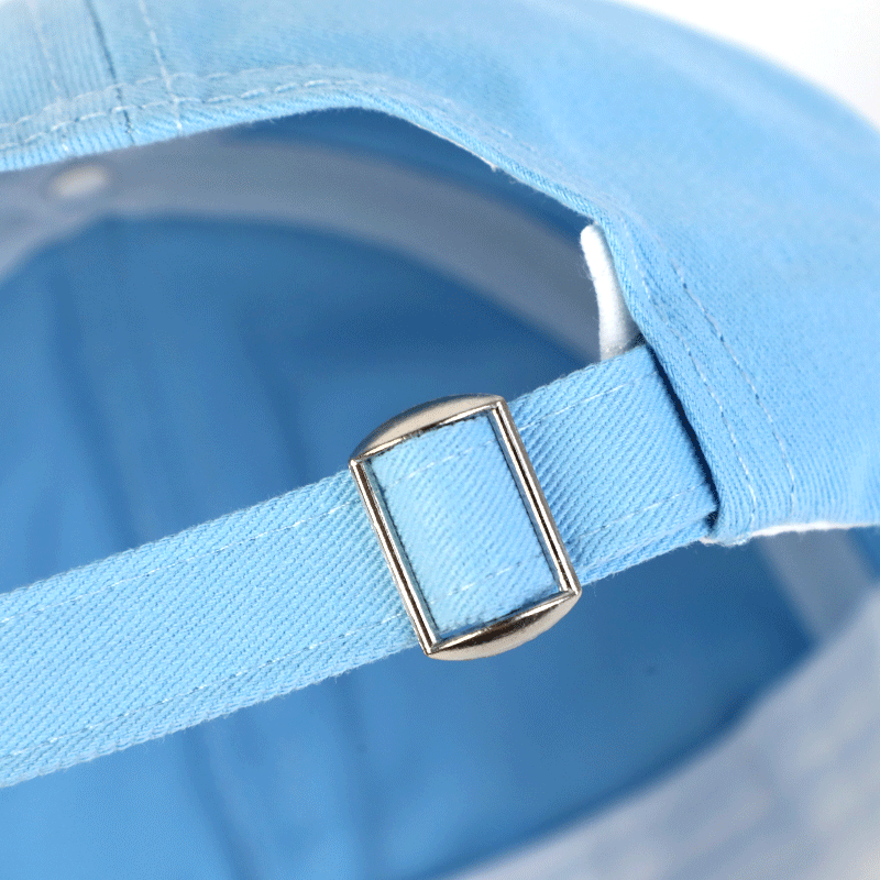 Adjustable light blue baseball cap strap with metal buckle close-up
