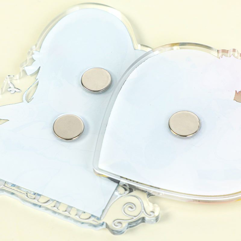 Back view of custom clear acrylic fridge magnets with round metal magnets attached.