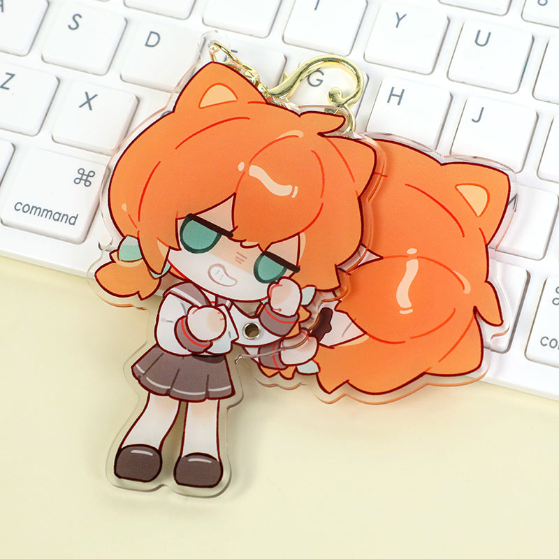 Custom multi-layer acrylic keychain with cute anime cat girl character on a keyboard