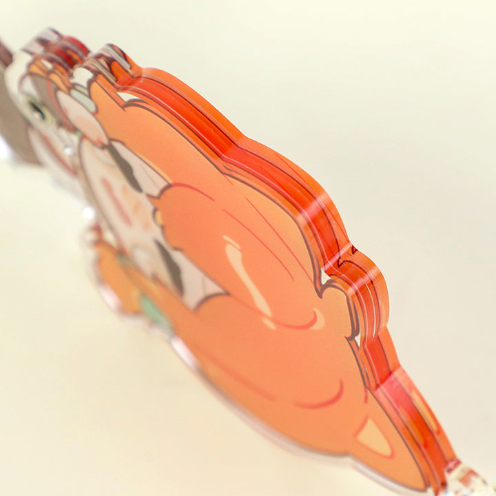 Multi-layer custom acrylic keychain featuring vibrant orange cartoon design, close-up view