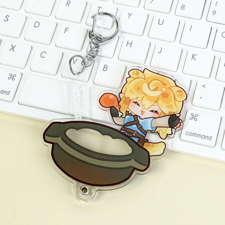 Custom multi-layer acrylic keychain with cute anime-style character and pot on white keyboard