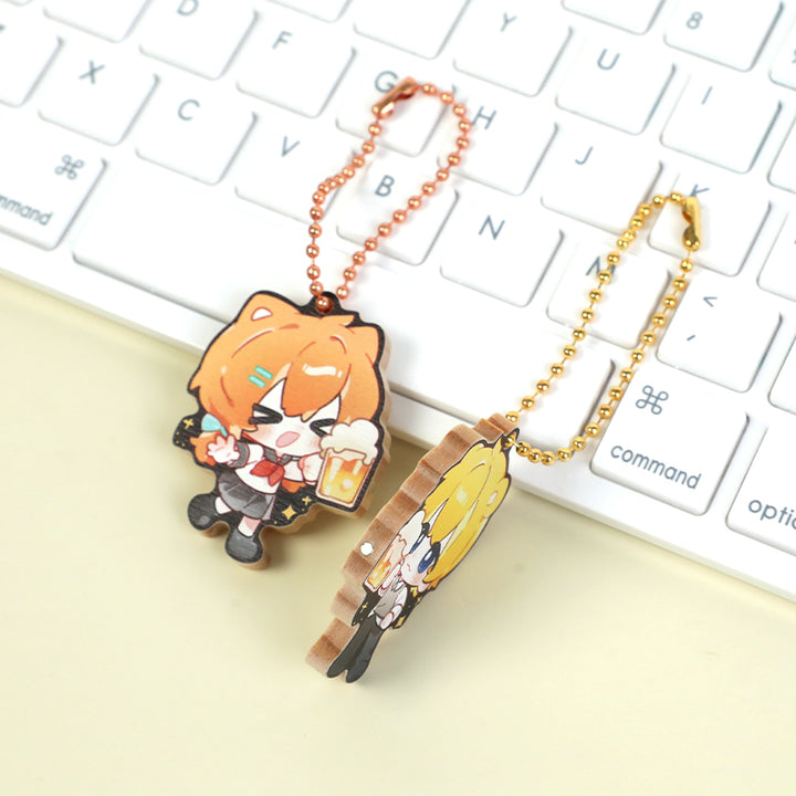 Custom wooden magnetic keychains with anime characters on a white keyboard