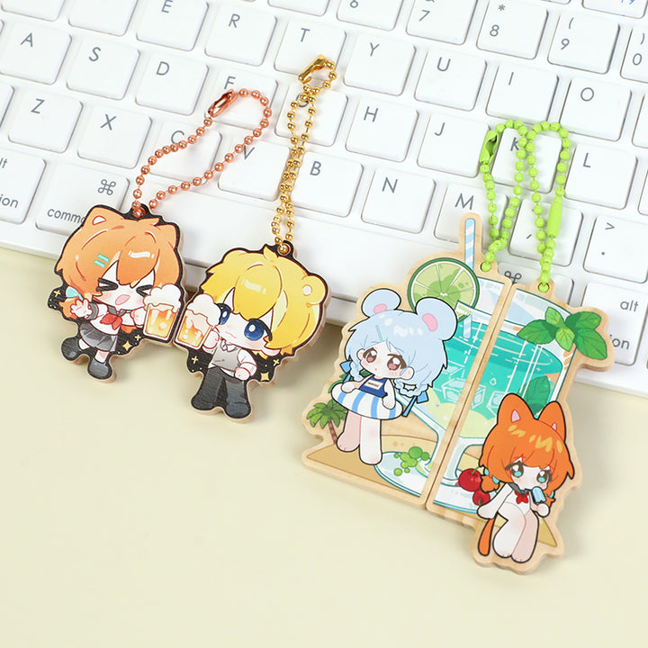 Custom wooden magnetic keychains with cute anime characters, displayed on a keyboard.