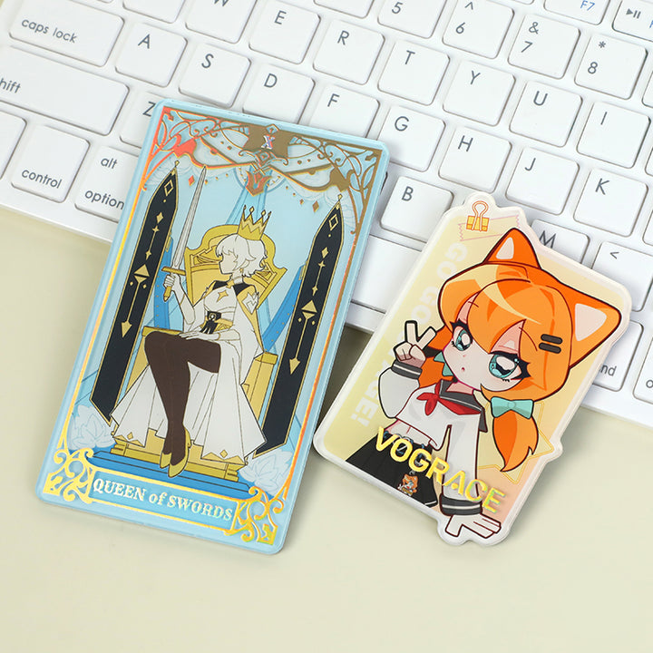 Custom acrylic fridge magnets with anime and tarot card designs on a keyboard background.