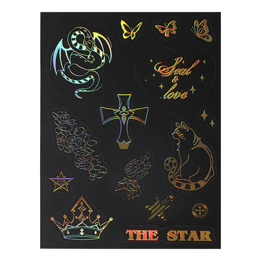 Custom raised foil sticker sheet with holographic dragon, cat, butterflies, cross, flowers, crown, and stars on black background.