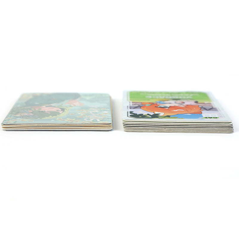 Two stacks of custom duplexed cards with colorful printed anime illustrations on a white background