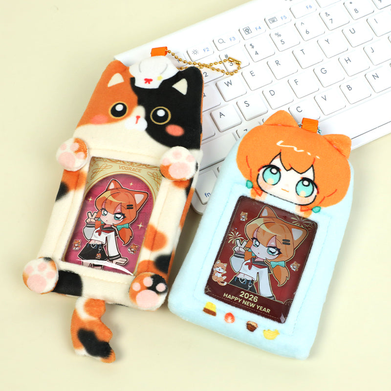 Custom plush cat-shaped card holders with anime girl cards on a keyboard background