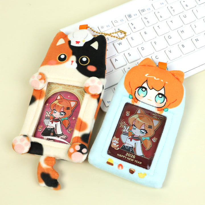 Custom plush cat-shaped card holders with anime girl cards on a keyboard background